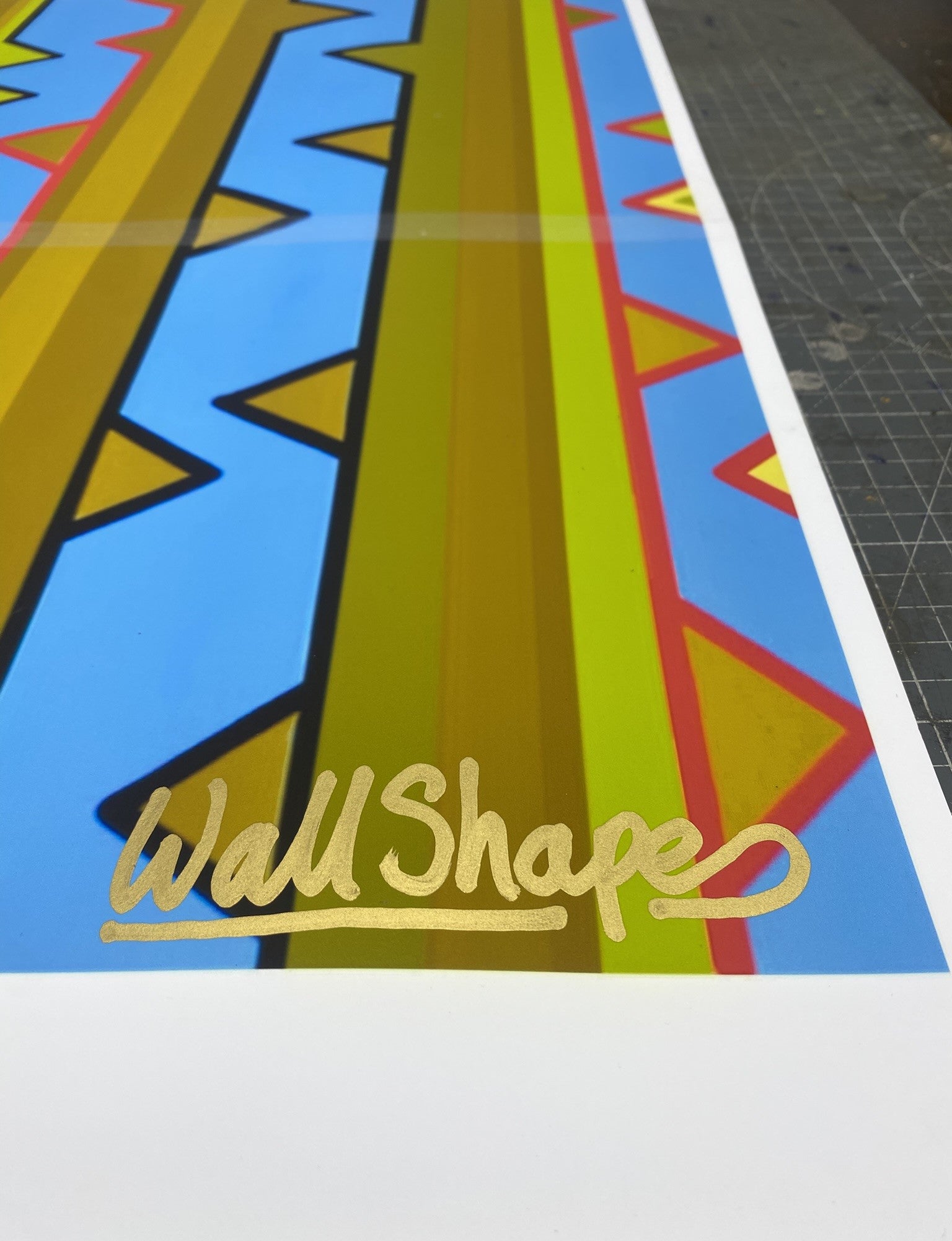 Colorful geometric patterned stencil print on a white background depicting rose stems detail of 'WallShapes' signature.