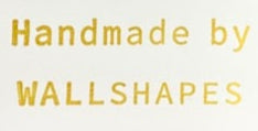 Text 'Handmade by WALLSHAPES' in gold on a white background
