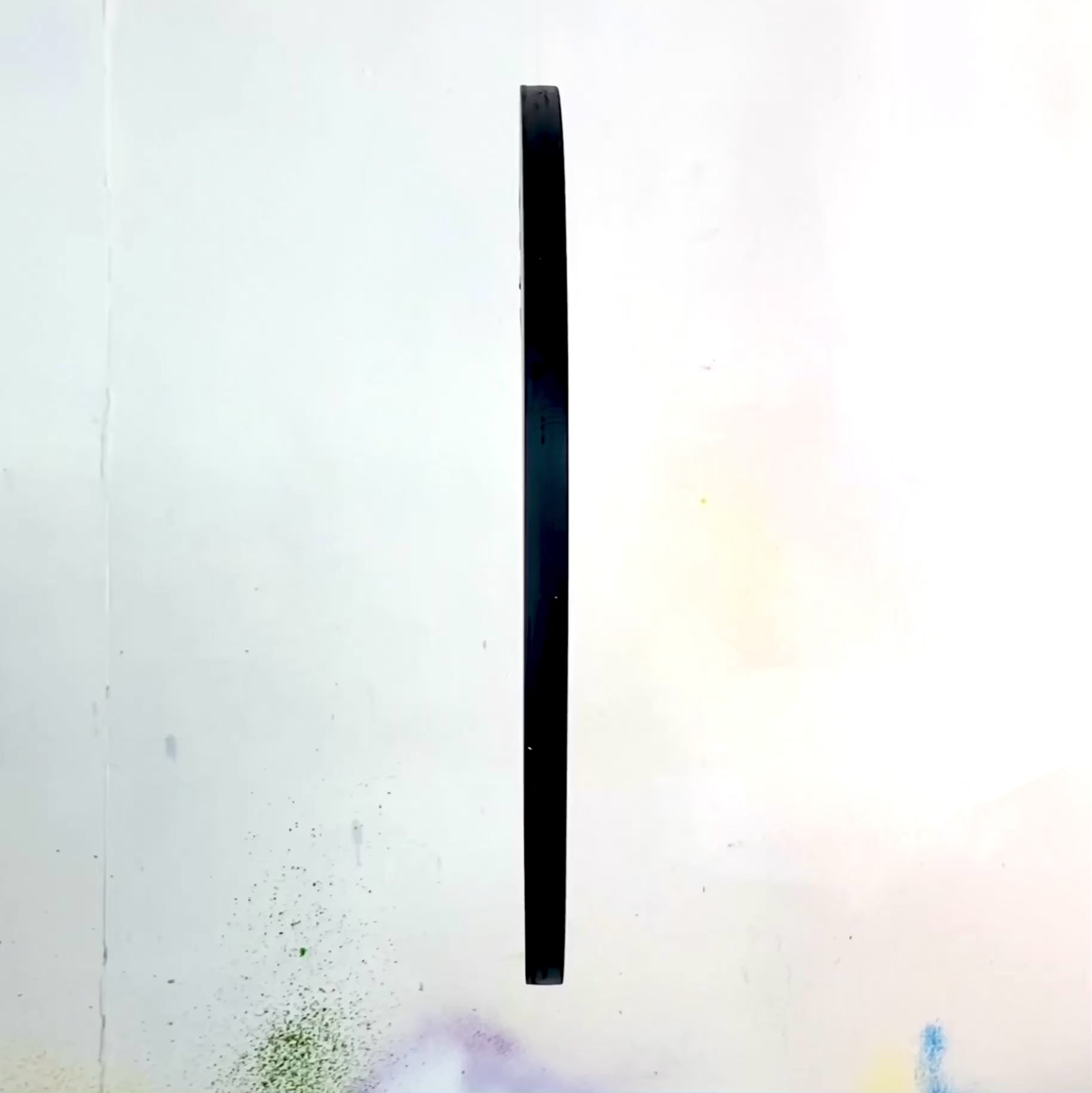 A video detailing a spray painted Smiley spinning to show all sides including the hanging hardware and signature of WallShapes. This video shows the wall art hanging from the main straight hanging position.