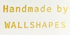 Text 'Handmade by WALLSHAPES' in gold on a white background
