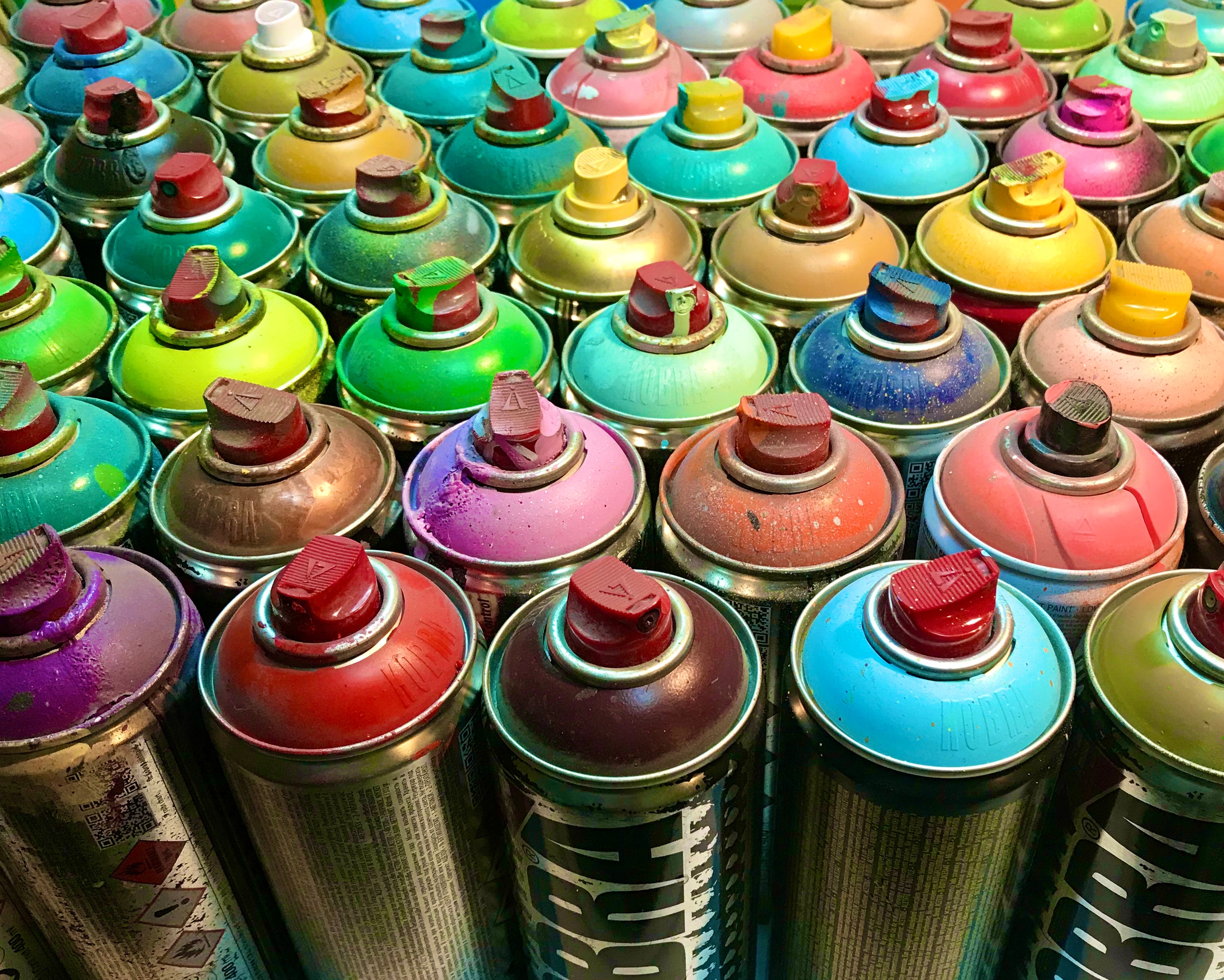 A grip of spray paint cans. Rattlers.